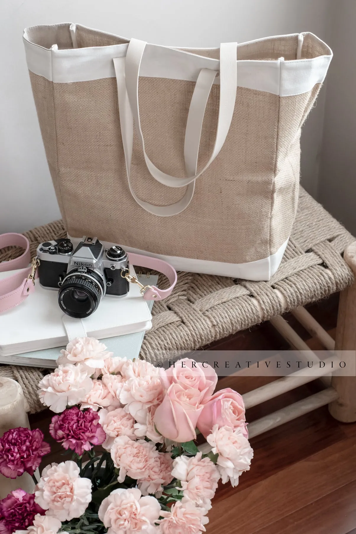 Tote, Camera and Flowers on Bench, Styled Stock Image